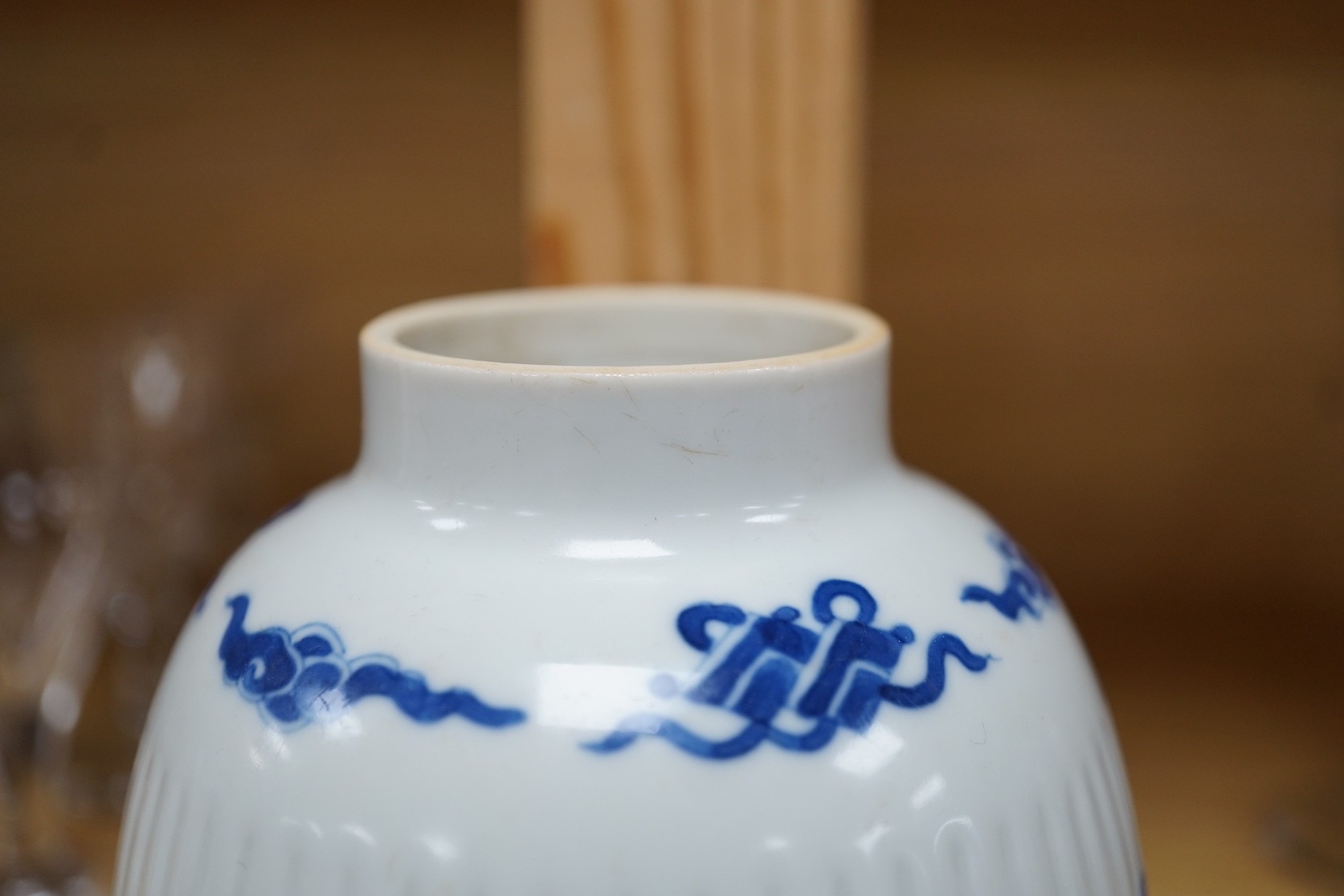 A Chinese blue and white fluted ovoid jar 16cm